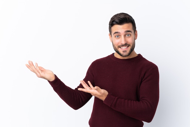 Caucasian handsome man over white wall