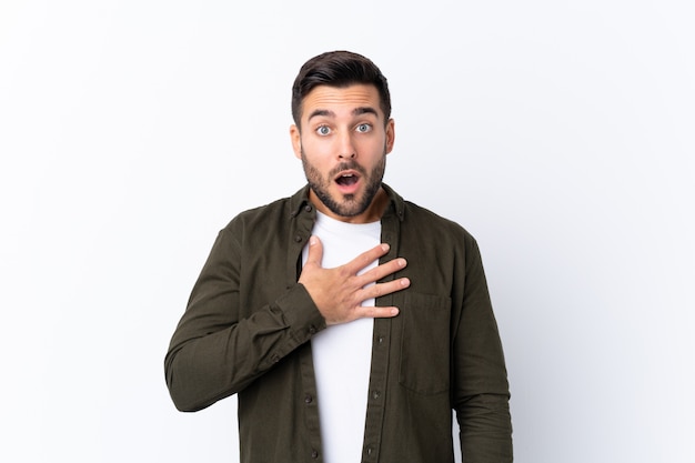 Caucasian handsome man over white wall