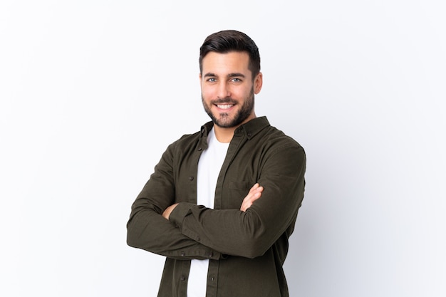 Caucasian handsome man over white wall