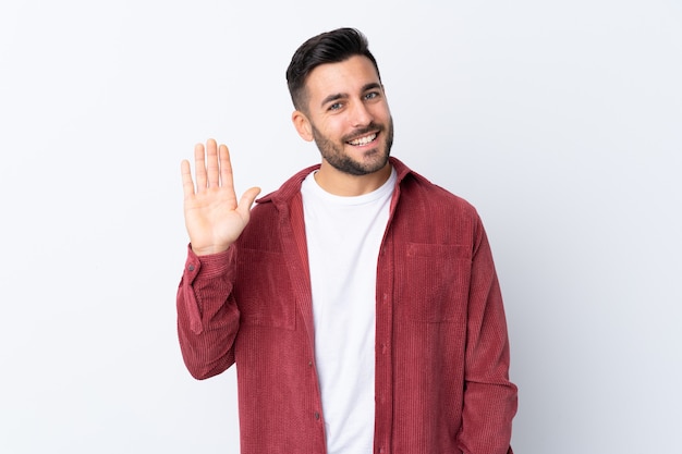 Caucasian handsome man over white wall