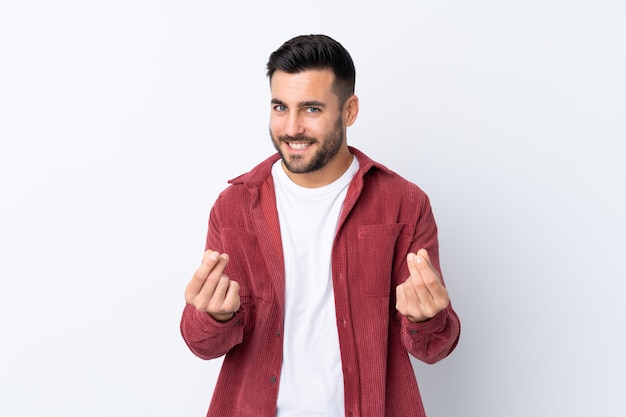 Caucasian handsome man over white wall