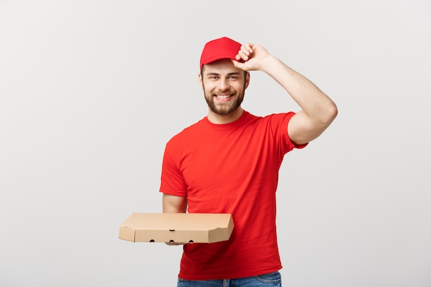 caucasian Handsome Pizza delivery man holding pizza boxes