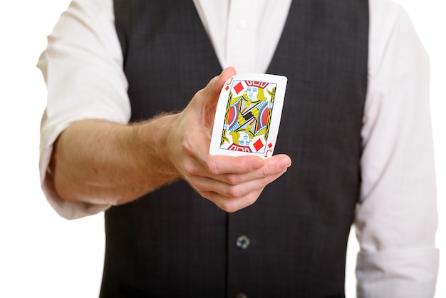 Caucasian magician man holding and bending Jack of Diamonds card