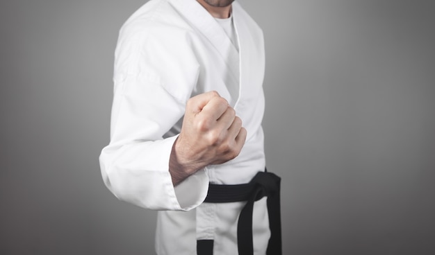 Caucasian male punch. Doing karate. Martial arts