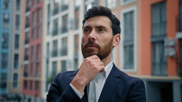 Caucasian male thoughtful businessman concentrated think of solution issue deep in thoughts