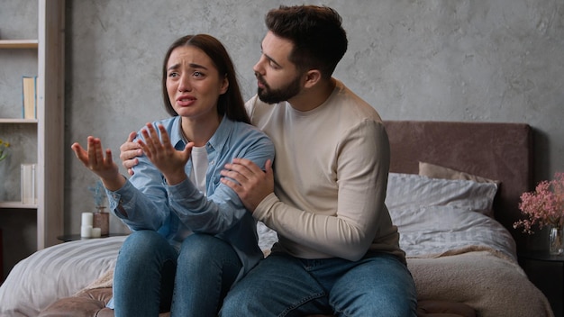 Caucasian man apologizing husband calming anxious annoyed wife ask forgiveness after family conflict