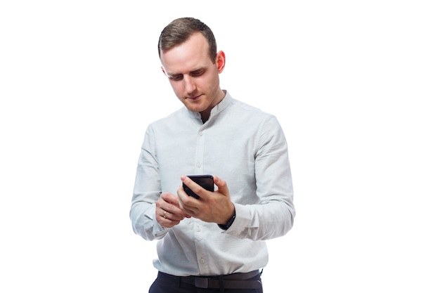 Caucasian man businessman, teacher mentor, talking on the phone and makes a selfie. He is wearing a shirt. Emotional portrait. Isolated on white background