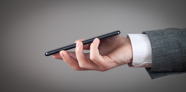 Caucasian man holding smartphone at home