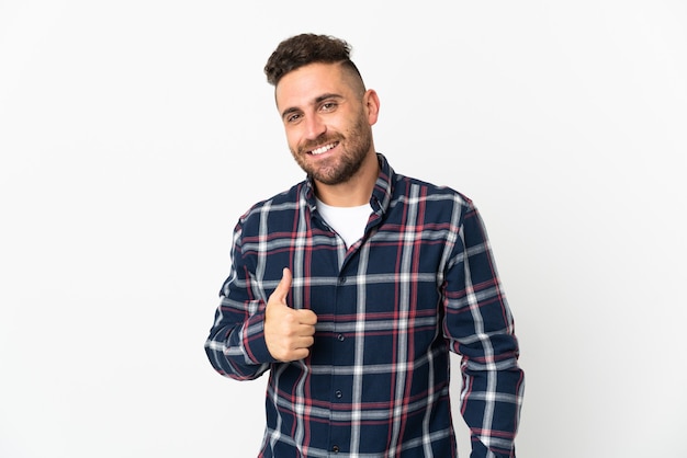 Caucasian man isolated on white background giving a thumbs up gesture