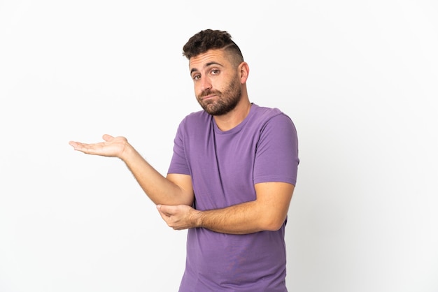 Caucasian man isolated on white background having doubts