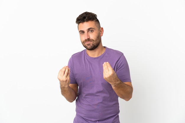 Caucasian man isolated on white background making money gesture but is ruined