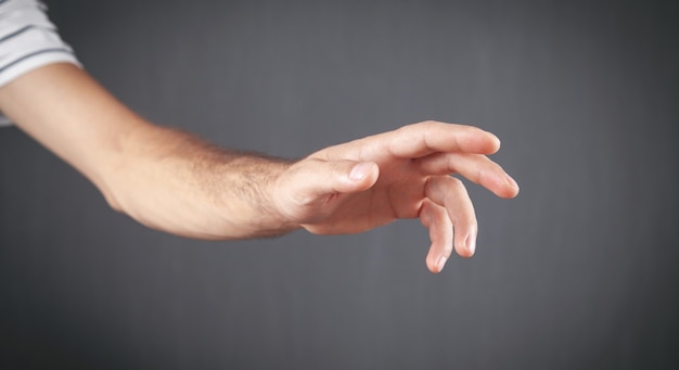 Caucasian man showing empty hand.