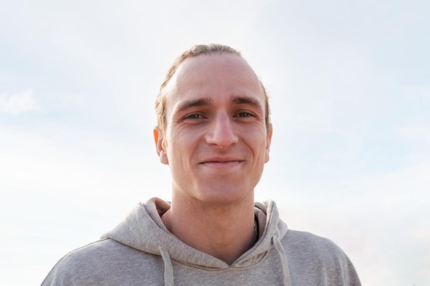 Caucasian man smiling happy and looking at camera