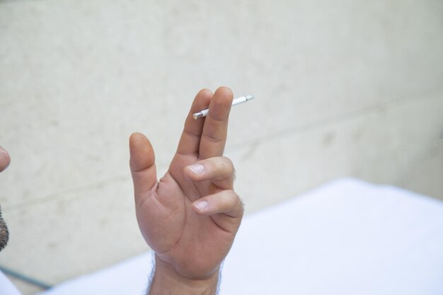 Caucasian man smoking a cigarette