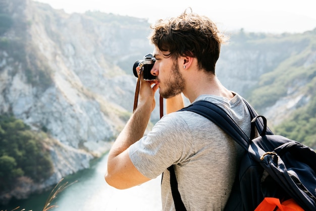 Caucasian man taking photo