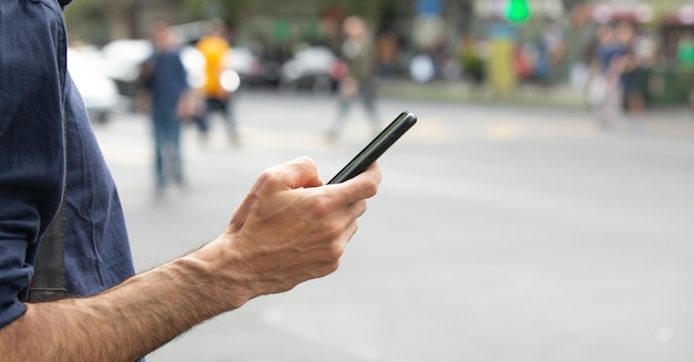 Caucasian man using smartphone in the city