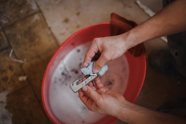 Caucasian man washes window frame details