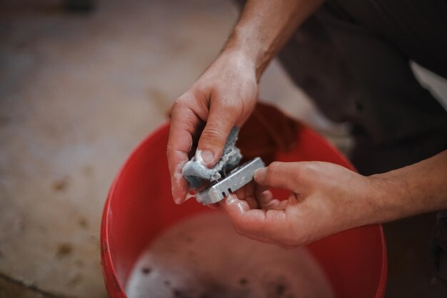 Caucasian man washes window frame details