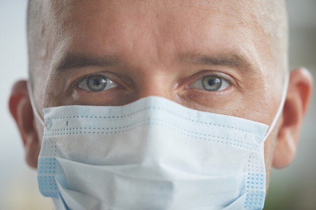 Caucasian man wearing protective mask on his face