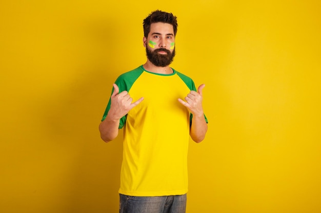 Caucasian man with beard brazilian soccer fan from brazil celebrating yes wow Victory