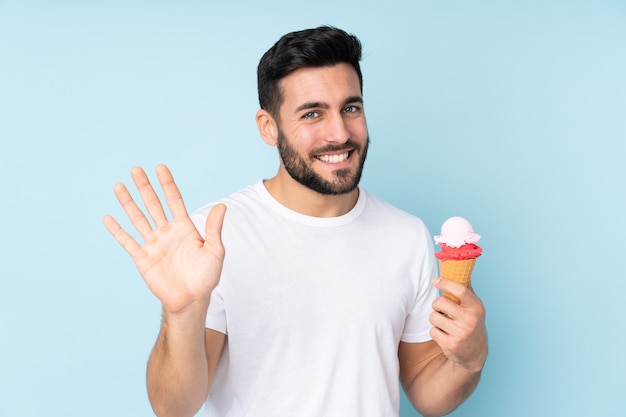 Caucasian man with a cornet ice cream isolated