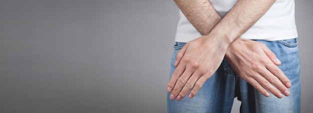 Caucasian man with crossing arms showing stop gesture