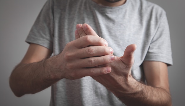 Caucasian man with fingers pain.