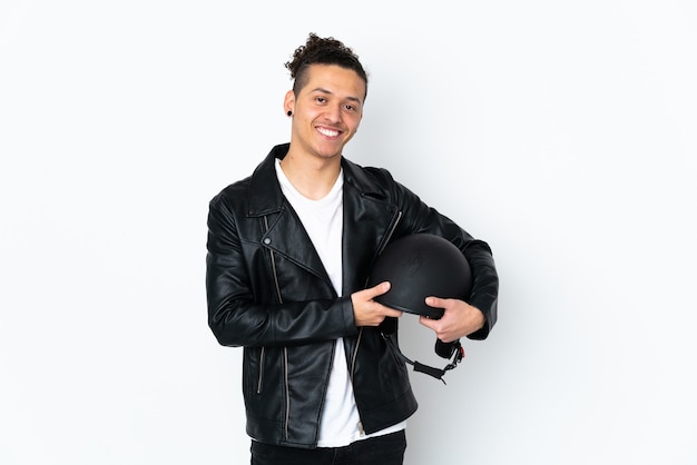 Caucasian man with a motorcycle helmet over isolated white background