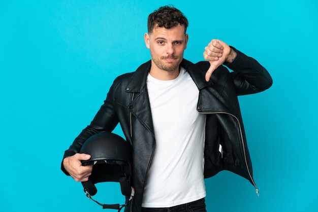 Caucasian man with a motorcycle helmet isolated