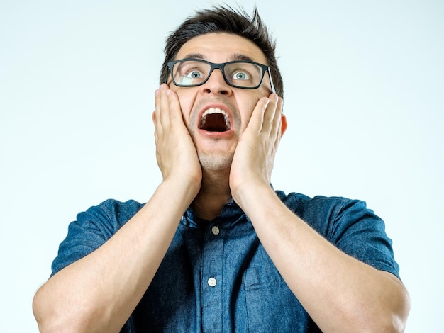 Caucasian man with surprised expression Isolated on gray background