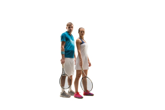 Caucasian man and woman as tennis players posing isolated on white background