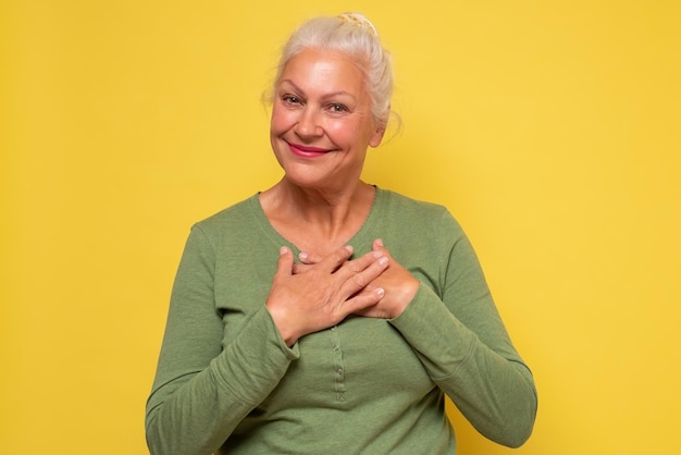 Caucasian mature woman is glad to hear a compliment