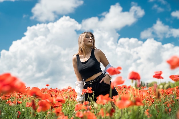 Caucasian model enjoy life at poppy field, sunny day. health lifestyle
