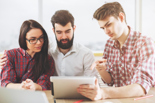 Caucasian people using tablet in office