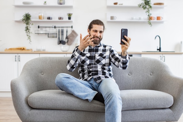 Caucasian person conducting online conference via modern device