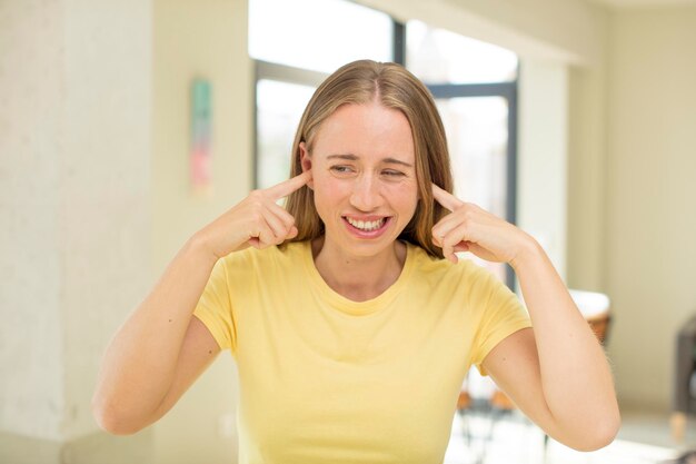 caucasian pretty woman expressing a concept in a home interior