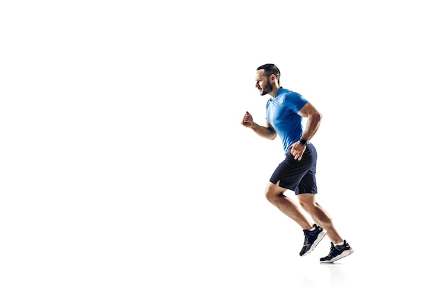 Caucasian professional male runner athlete training isolated on white studio background Copyspace for ad