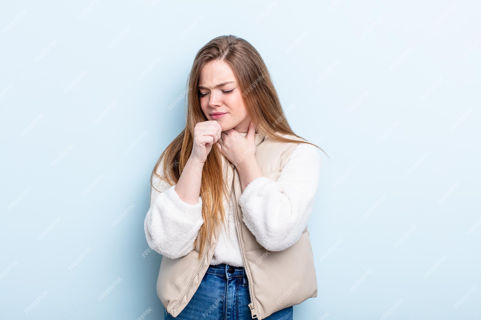 Premium Photo | Caucasian red hair woman feeling ill with a sore throat and flu symptoms, coughing with mouth covered Premium Photo | Caucasian red hair woman feeling ill with a sore throat and flu symptoms, coughing with mouth covered