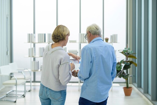 Caucasian senior Business people working and brainstorming in modern office