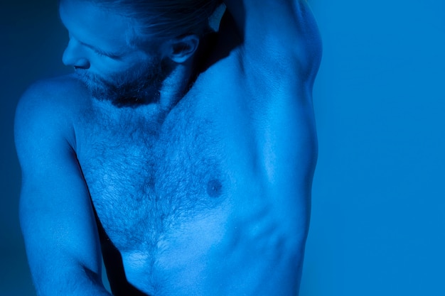 Caucasian shirtless man showing awareness for prostate cancer