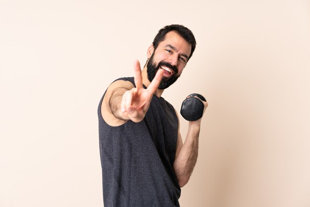 Caucasian sport man with beard making weightlifting isolated