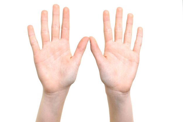 Caucasian white girl is showing her hands with open palms on a white background in closeup