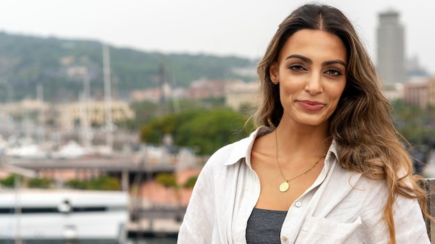 Caucasian woman in Barcelona, Spain. Posing near port