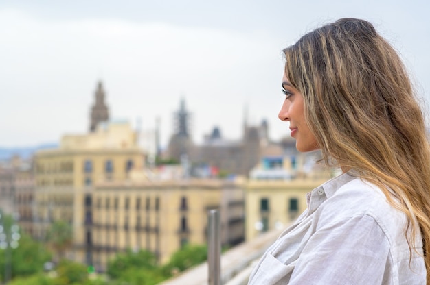 Caucasian woman in Barcelona, Spain. Posing near port