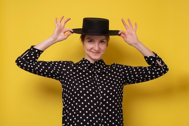 Caucasian woman in black hat with smile looking at camera positive emotions and beauty concept