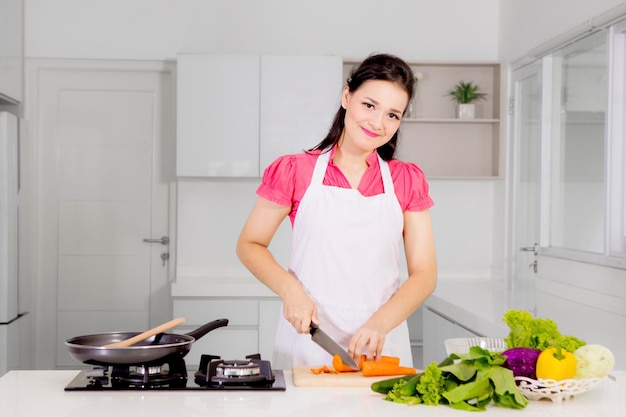 Caucasian woman cooking in the kitchen