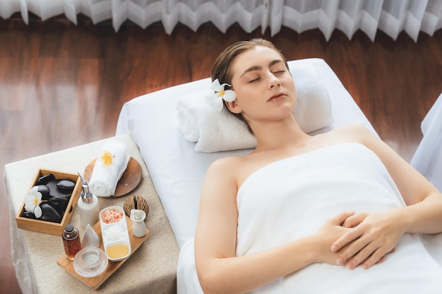 Caucasian woman customer enjoying relaxing antistress massage quiescent