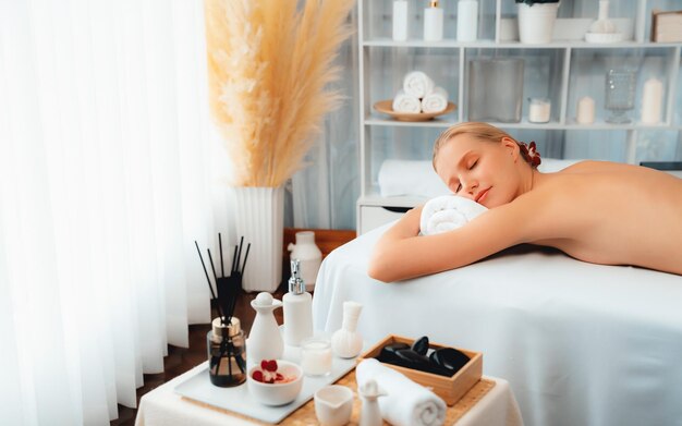 Caucasian woman customer enjoying relaxing antistress massage quiescent