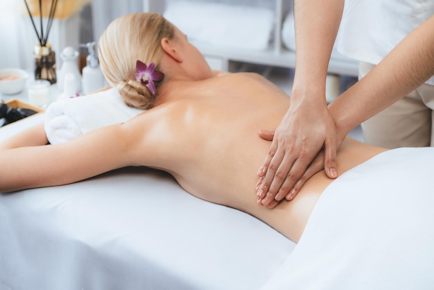 Caucasian woman customer enjoying relaxing antistress massage Quiescent