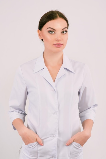 Caucasian woman doctor in white uniform